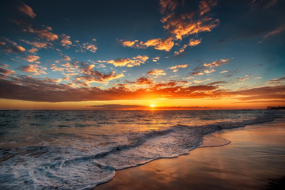Florida Gulf Coast beach sunset orange sky ocean horizon